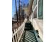 Home's exterior with white siding, green steps, and a picket fence at 119 Creek View Rd, Mooresville, NC 28117