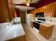 View of kitchen with wood cabinets, white countertops, and black appliances at 119 Creek View Rd, Mooresville, NC 28117