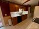 Kitchen features wood cabinets, white countertops, and black appliances at 119 Creek View Rd, Mooresville, NC 28117
