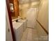Laundry room with washer, dryer, and built-in shelving at 119 Creek View Rd, Mooresville, NC 28117