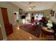 Bright living room with hardwood floors, comfortable seating, and a view into another room at 119 Creek View Rd, Mooresville, NC 28117