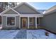 Attractive front entrance with a covered porch and walkway at 1487 Marshbrooke Ln, Catawba, NC 28609