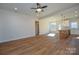 Open concept living and kitchen area with wood-look flooring at 1487 Marshbrooke Ln, Catawba, NC 28609