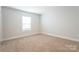 Simple bedroom with neutral walls and carpeted floor at 162 Wembury Ln, Troutman, NC 28166