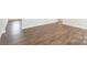 Empty room showcasing wood-look floors and white baseboards at 162 Wembury Ln, Troutman, NC 28166