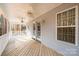 Peaceful back porch with wooden deck and ceiling fans at 165 Pine Valley Dr, Stanley, NC 28164