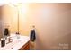 Small bathroom with single sink and mirror at 165 Pine Valley Dr, Stanley, NC 28164