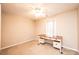 Bright bedroom with a desk and window overlooking trees at 165 Pine Valley Dr, Stanley, NC 28164