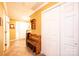 Entryway with tile flooring, bench, and coat closet at 165 Pine Valley Dr, Stanley, NC 28164
