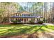 Two-story house with a wraparound porch and landscaped lawn at 165 Pine Valley Dr, Stanley, NC 28164