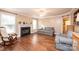 Living room with hardwood floors, fireplace, and comfortable seating at 165 Pine Valley Dr, Stanley, NC 28164