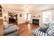 Living room features hardwood floors, a fireplace, and access to other rooms at 165 Pine Valley Dr, Stanley, NC 28164