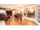 Open living room and kitchen with hardwood floors and French doors at 165 Pine Valley Dr, Stanley, NC 28164