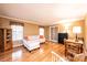 Living room with hardwood floors, L-shaped sofa, and small table at 165 Pine Valley Dr, Stanley, NC 28164