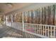 Spacious porch overlooking a wooded area with a kayak at 165 Pine Valley Dr, Stanley, NC 28164