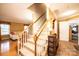 Indoor staircase with wooden railings and carpeted steps at 165 Pine Valley Dr, Stanley, NC 28164