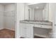 Bathroom with granite vanity, white cabinets, and a bathtub at 171 Wembury Ln, Troutman, NC 28166