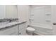 Clean bathroom with granite countertop, white cabinets, and shower/tub combo at 171 Wembury Ln, Troutman, NC 28166