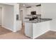 Modern kitchen with granite countertops, stainless steel appliances, and white cabinets at 171 Wembury Ln, Troutman, NC 28166