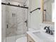 Renovated bathroom features a walk-in shower with marble tile and modern vanity at 188 Mary Cir, Concord, NC 28025