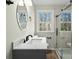 Modern bathroom with large vanity, walk-in shower, and bright window at 188 Mary Cir, Concord, NC 28025