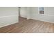 Spacious bedroom with wood-look floors and a window at 188 Mary Cir, Concord, NC 28025