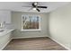Dining area with wood-look floors and a window view at 188 Mary Cir, Concord, NC 28025
