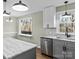 Modern kitchen features marble countertops, stainless steel appliances, and ample cabinet space at 188 Mary Cir, Concord, NC 28025