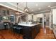 Open concept kitchen with large island, gas cooktop and stainless steel appliances at 2002 Streamview Ct, Waxhaw, NC 28173