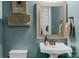 Small bathroom with pedestal sink and decorative mirror at 2008 Thurston Dr, Indian Trail, NC 28079