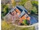 Brick home with large yard, driveway, and landscaping, seen from above at 2010 Lake Forest Dr, Fort Mill, SC 29708