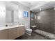 Modern bathroom with a glass shower, gray tile, and sleek vanity offering a spa-like retreat at 2103 Cortelyou Rd, Charlotte, NC 28211