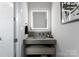Contemporary bathroom featuring a floating vanity with an illuminated mirror at 2103 Cortelyou Rd, Charlotte, NC 28211