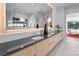 Elegant bathroom with dual sinks, a large mirror with vanity lighting and stylish decor at 2103 Cortelyou Rd, Charlotte, NC 28211