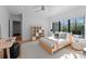 Bedroom with hardwood floors, large windows, and modern decor with a comfortable bed at 2103 Cortelyou Rd, Charlotte, NC 28211