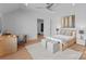 Bright bedroom featuring hardwood floors, natural light, and a comfortable bed with modern decor at 2103 Cortelyou Rd, Charlotte, NC 28211