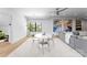 Bright dining area boasts natural light, white furniture, and an open layout, great for entertaining at 2103 Cortelyou Rd, Charlotte, NC 28211