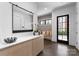 Inviting entryway with a large mirror, bench seating, and stylish decor at 2103 Cortelyou Rd, Charlotte, NC 28211