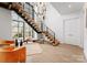 Impressive foyer featuring a modern staircase, large windows, and stylish decor, creating a grand entrance at 2103 Cortelyou Rd, Charlotte, NC 28211
