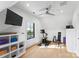 Bright home gym featuring a stationary bike, weight bench, and modern storage solutions for fitness at 2103 Cortelyou Rd, Charlotte, NC 28211