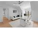 Bright home office featuring a white desk, comfortable seating, and a ceiling fan at 2103 Cortelyou Rd, Charlotte, NC 28211