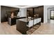 Modern kitchen featuring sleek dark cabinetry, dual islands, and high-end finishes at 2103 Cortelyou Rd, Charlotte, NC 28211