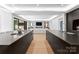 Spacious kitchen and living area featuring a large island and modern design at 2103 Cortelyou Rd, Charlotte, NC 28211