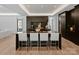 Elegant kitchen with modern appliances, a large island with seating, and sleek cabinetry at 2103 Cortelyou Rd, Charlotte, NC 28211