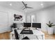 Spacious office featuring hardwood floors, a ceiling fan, and bright lighting at 2103 Cortelyou Rd, Charlotte, NC 28211