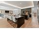 Open-concept kitchen and living room with high-end finishes and a seamless design at 2103 Cortelyou Rd, Charlotte, NC 28211