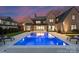 Beautiful backyard featuring a sparkling pool, lounge chairs, and ample space for outdoor entertaining and relaxation at 2103 Cortelyou Rd, Charlotte, NC 28211