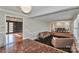 Cozy living room with hardwood floors, neutral walls, and an open layout to the dining area at 251 Gleneagles E Rd, Statesville, NC 28625