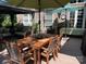 Outdoor patio dining area with wooden table and chairs at 270 Bent Tree Dr, Stanley, NC 28164