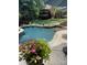 Expansive pool with a waterfall and lush landscaping at 270 Bent Tree Dr, Stanley, NC 28164